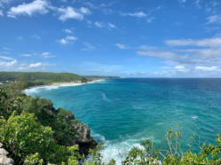 Photo overlooking coastline along deep blue water at Guajataca Cliffs, Quebradillas, Puerto Rico.
